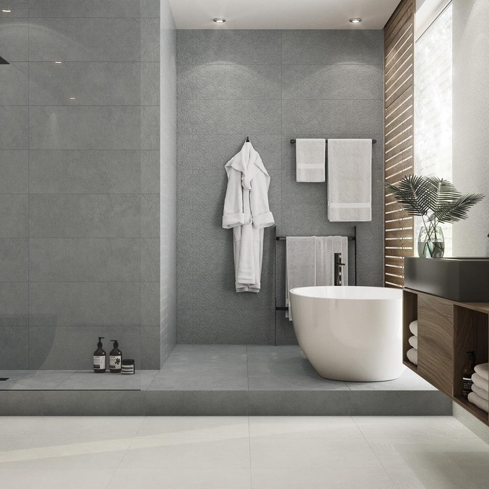 Modern bathroom with a stylish white vanity enhanced by grey tile design