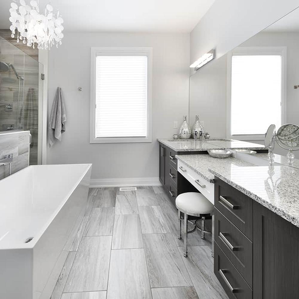 Remarkable centerpiece adds character to a modern grey bathroom