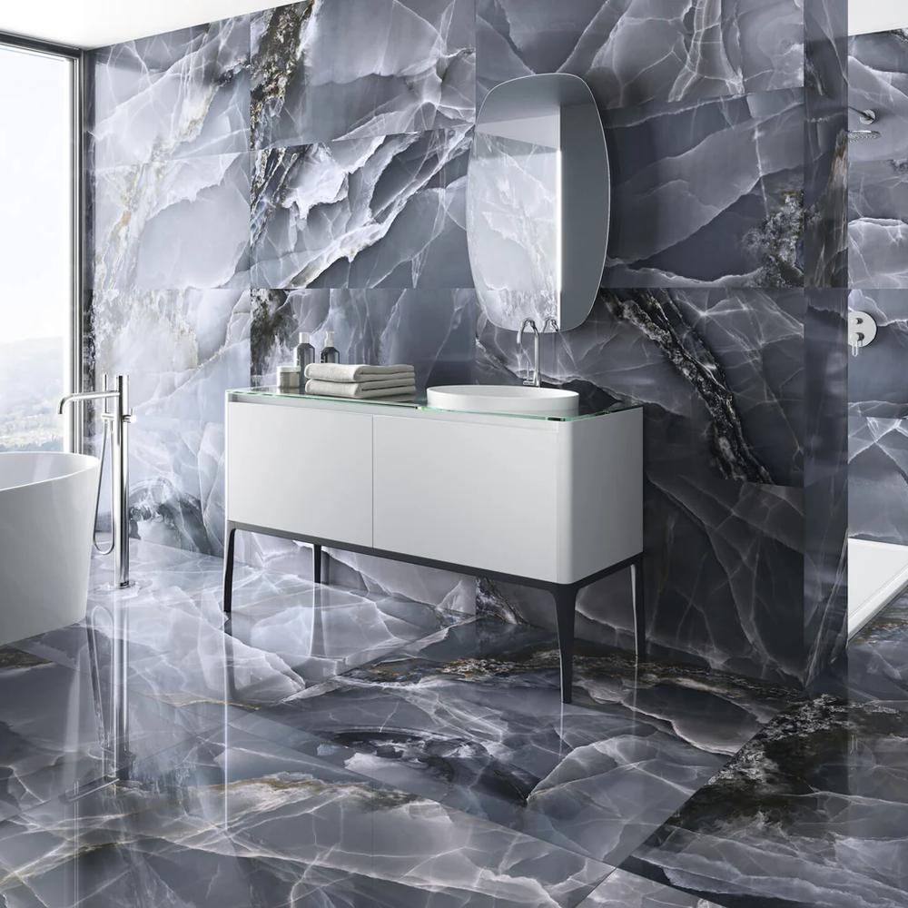 Finishing touches with textiles enhance the comfort of a modern grey tile bathroom