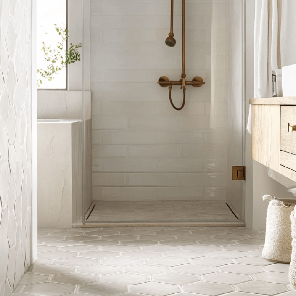 Minimalist bathroom featuring light hexagon tile flooring.