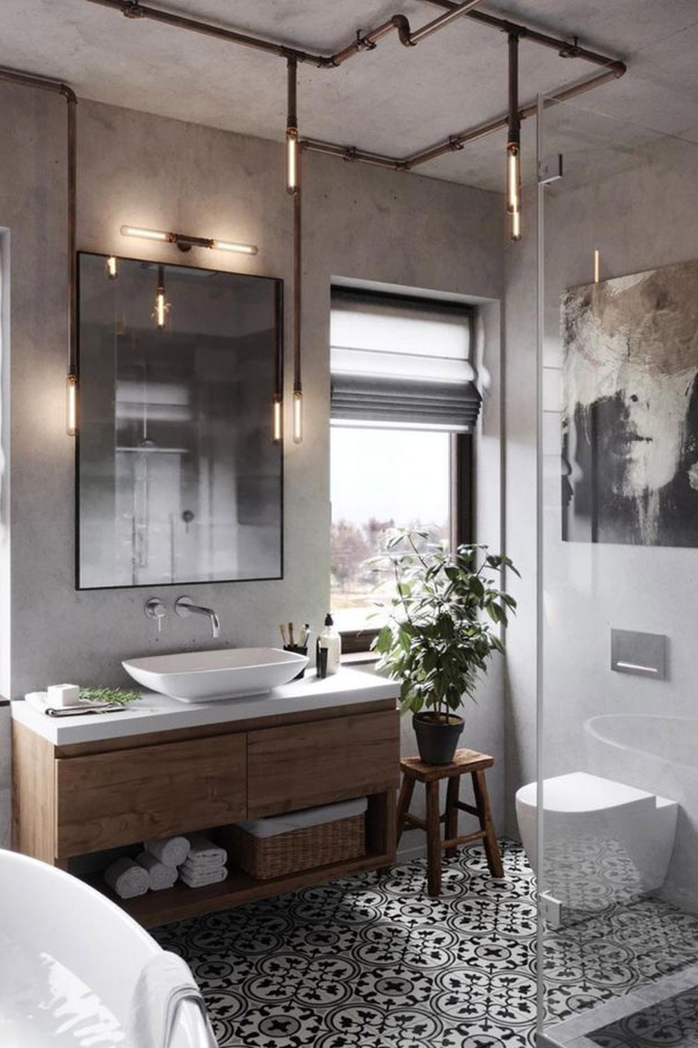 A contemporary industrial bathroom showcasing a wooden vanity, bowl-shaped sink, and vibrant green plants.