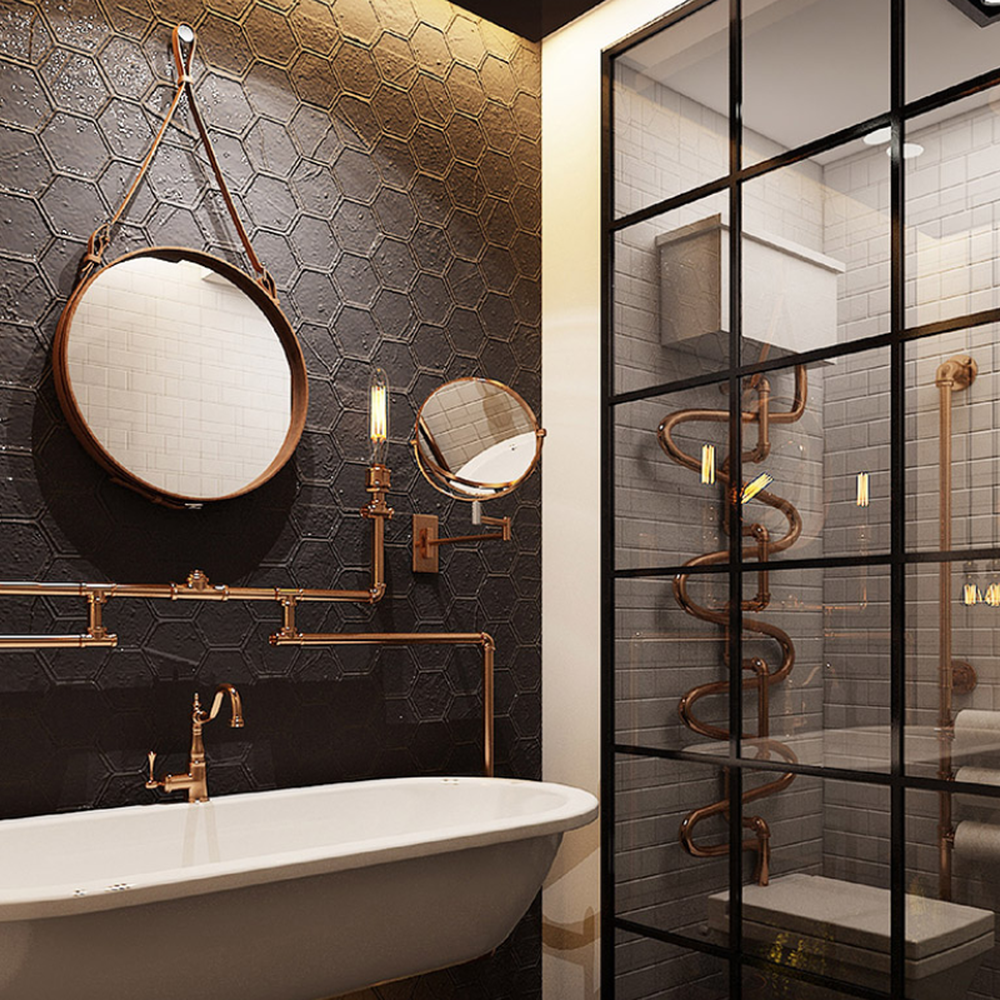 An industrial bathroom with matte black hexagonal tiles, stylish mirrors, and copper-colored plumbing.