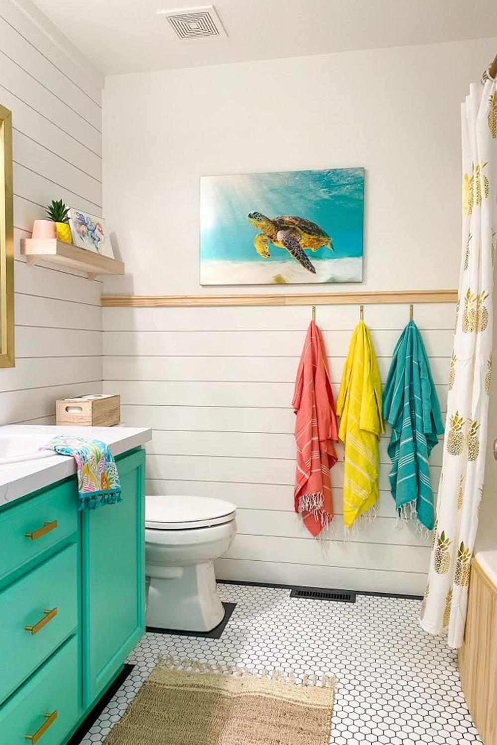A tropical-themed kids' bathroom filled with fun accents and cheerful colors.