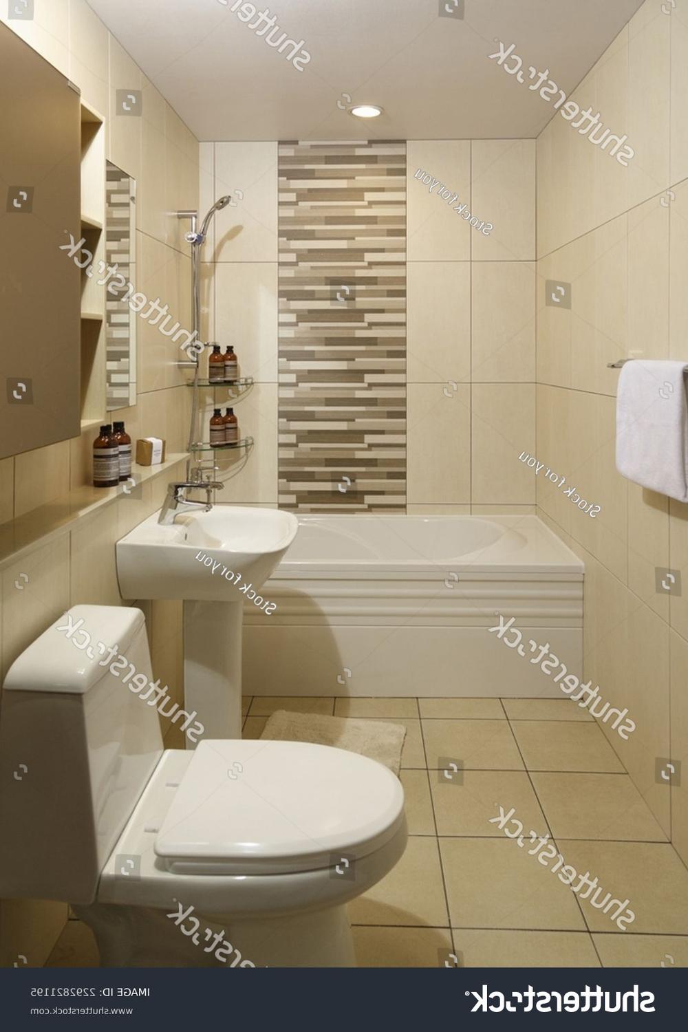 A modern bathroom finished in neutral tones, with a stylish sink and elegant shower area.