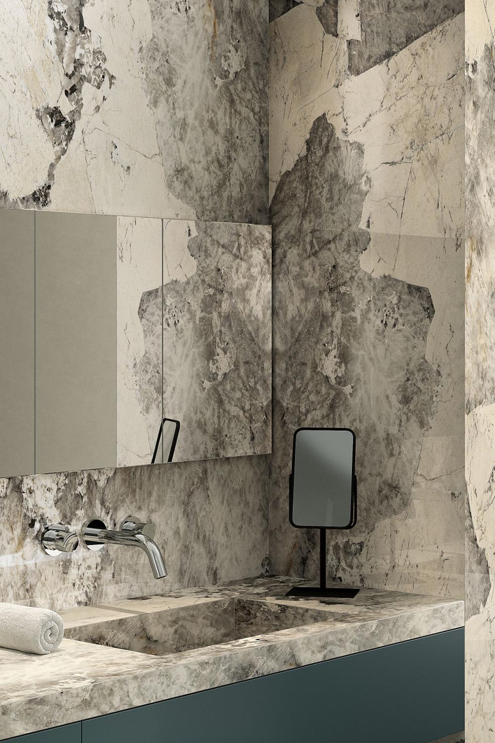 Bathroom featuring large-format marble effect tiles in a luxurious setting