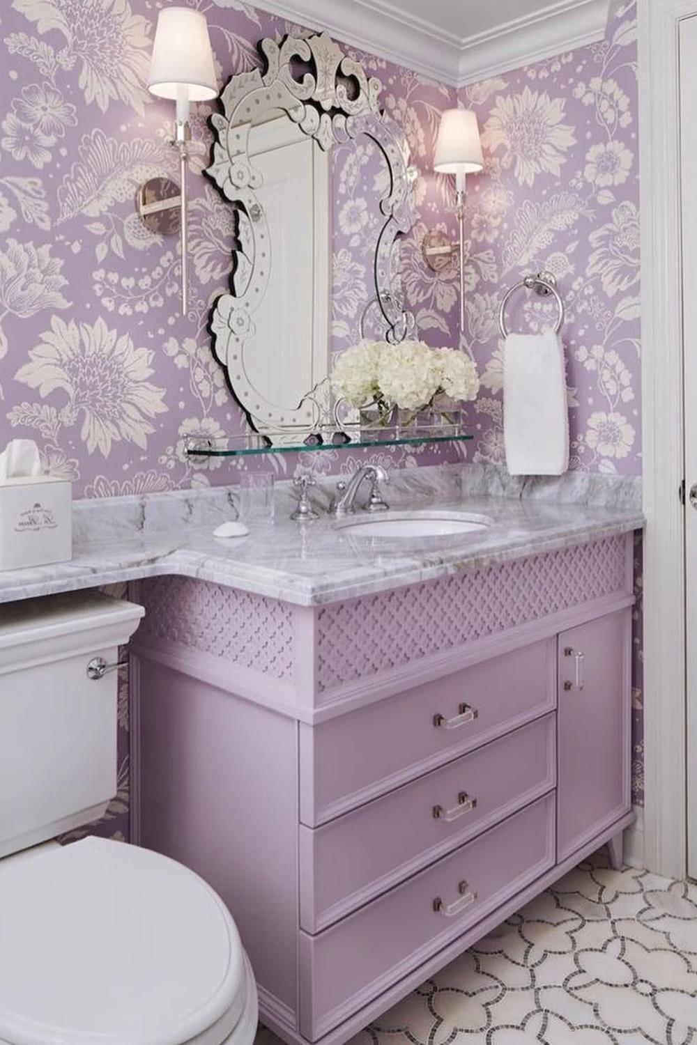 Elegant bathroom showcasing floral wallpaper and modern lighting.
