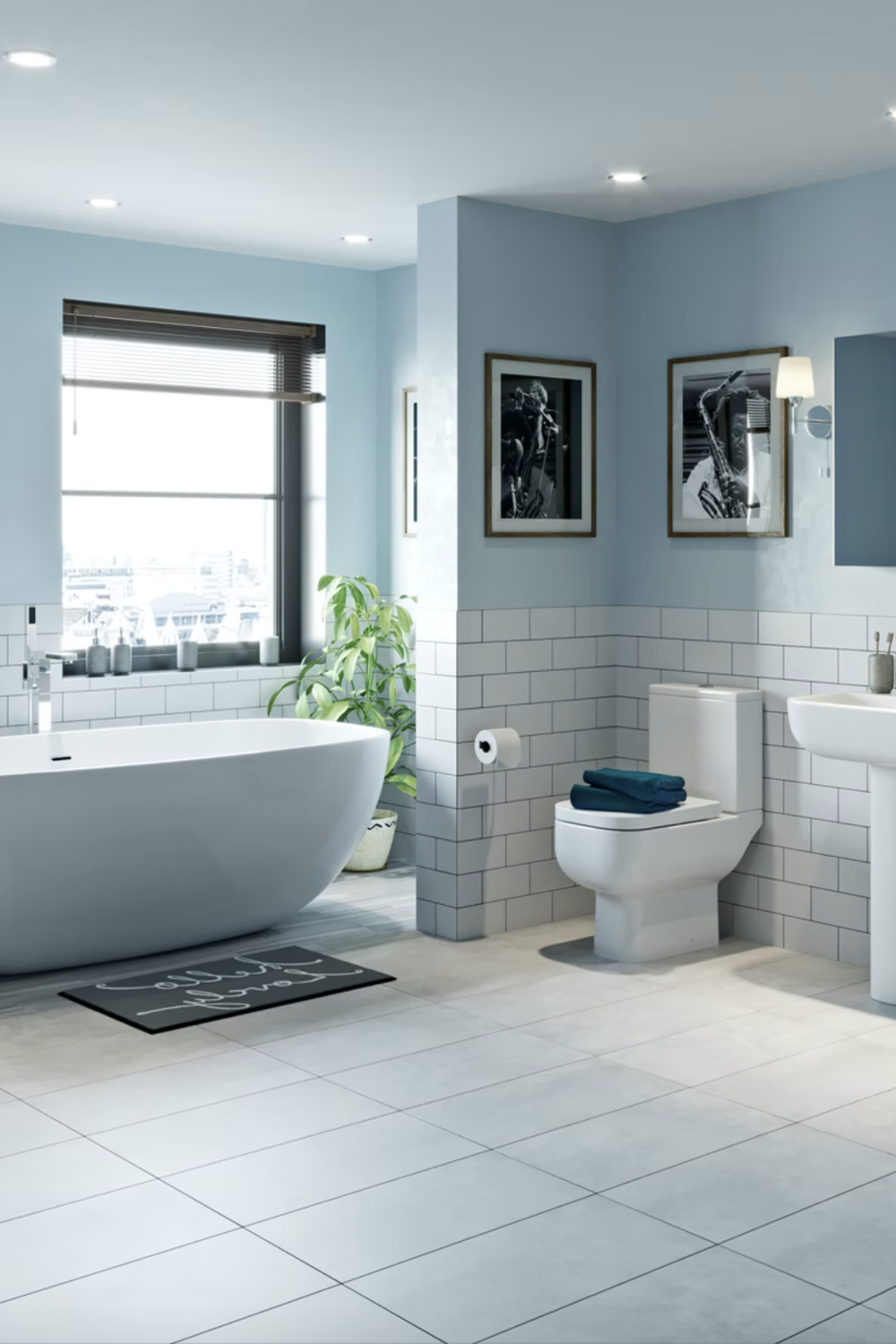 Contemporary light blue bathroom featuring a freestanding bathtub