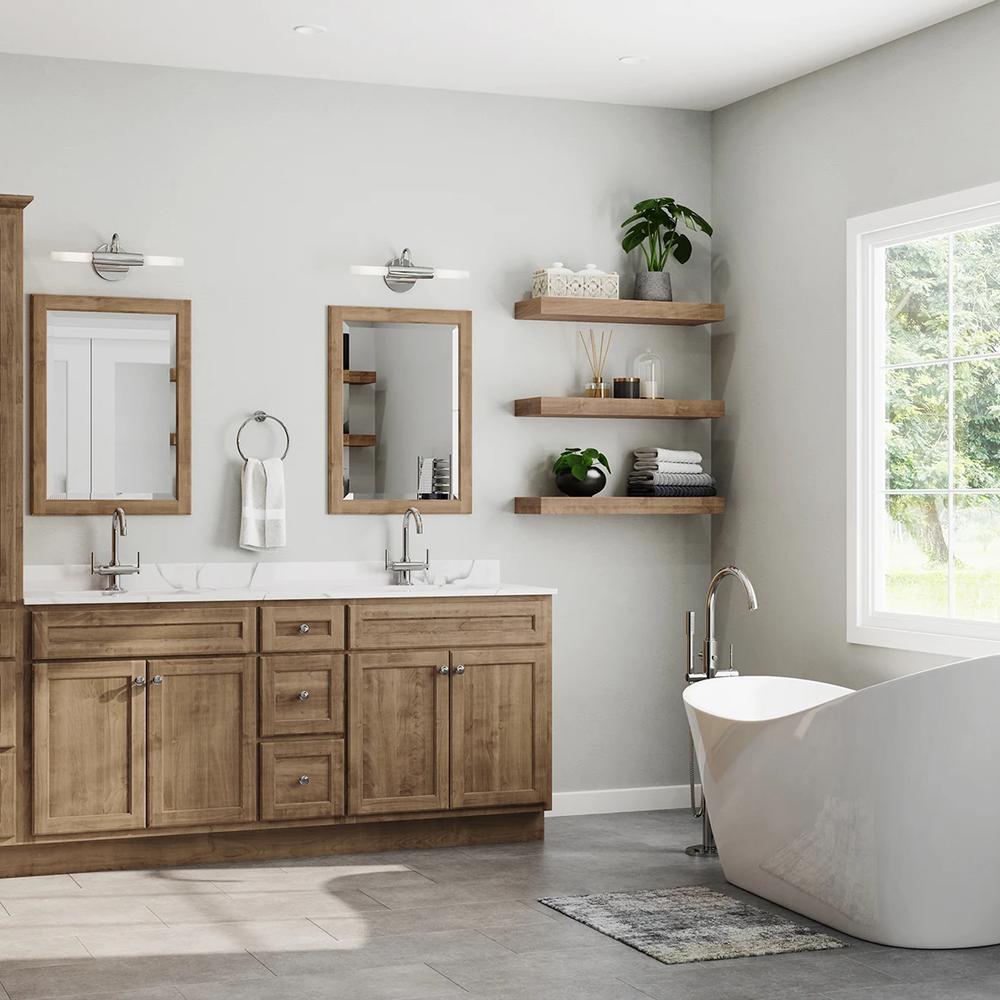 Brightly lit light wood vanity with efficient layout.