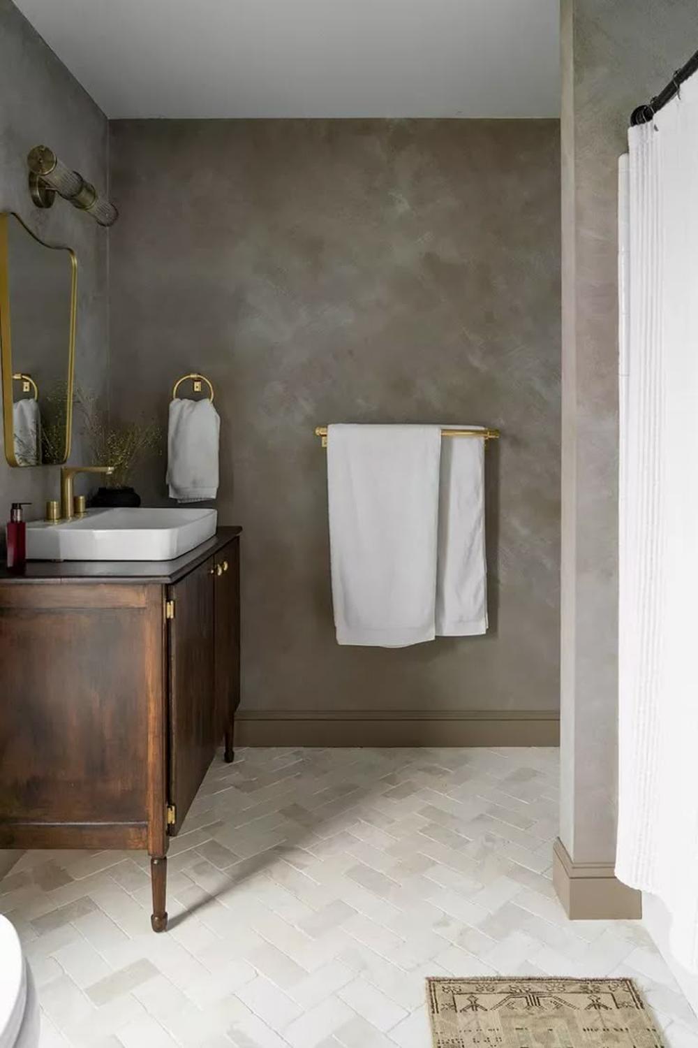 A stylish contemporary bathroom dominated by a smooth limewash finish.