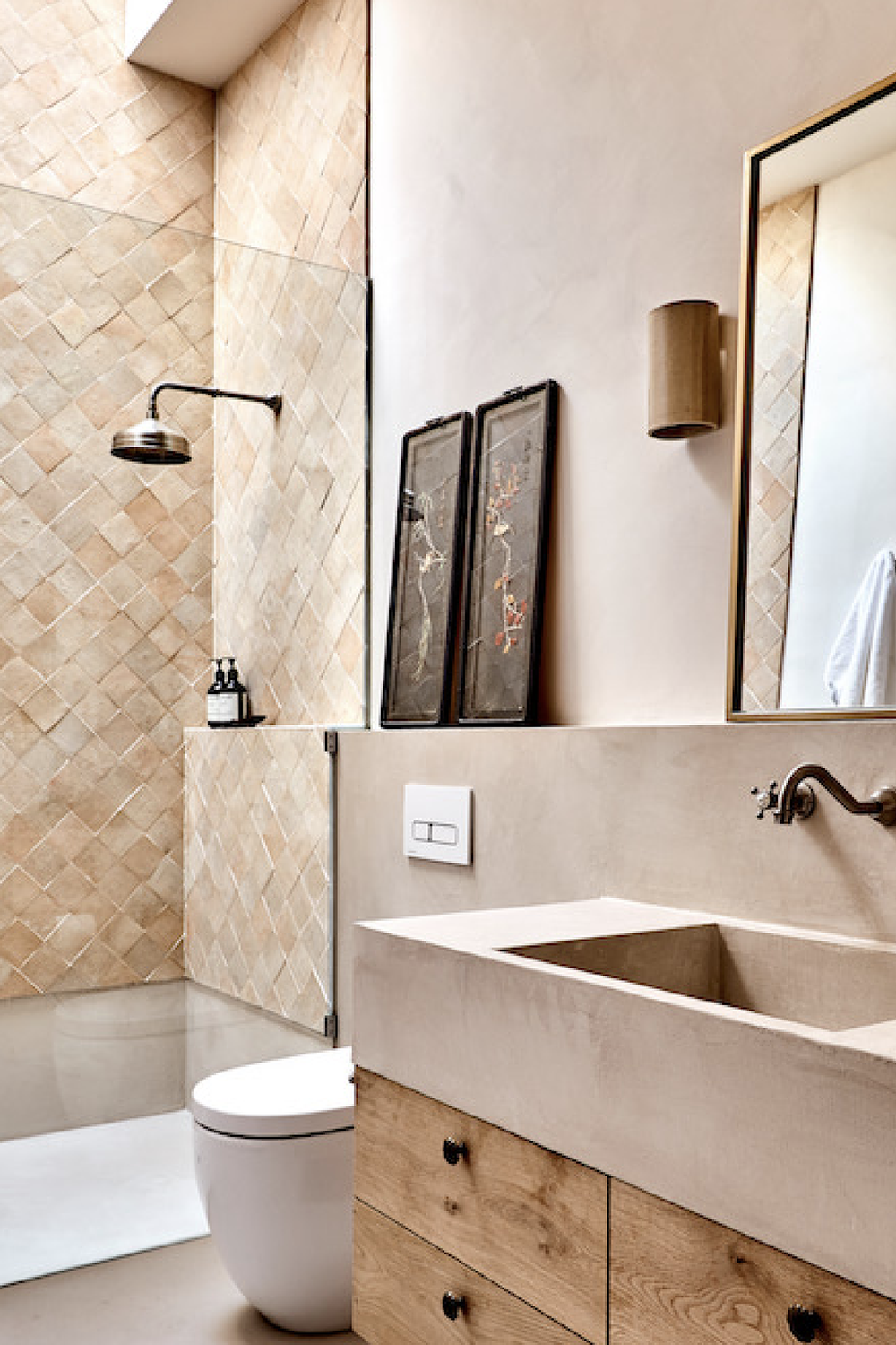 A stylish bathroom with rustic elements combined with modern touches in a limewash aesthetic.