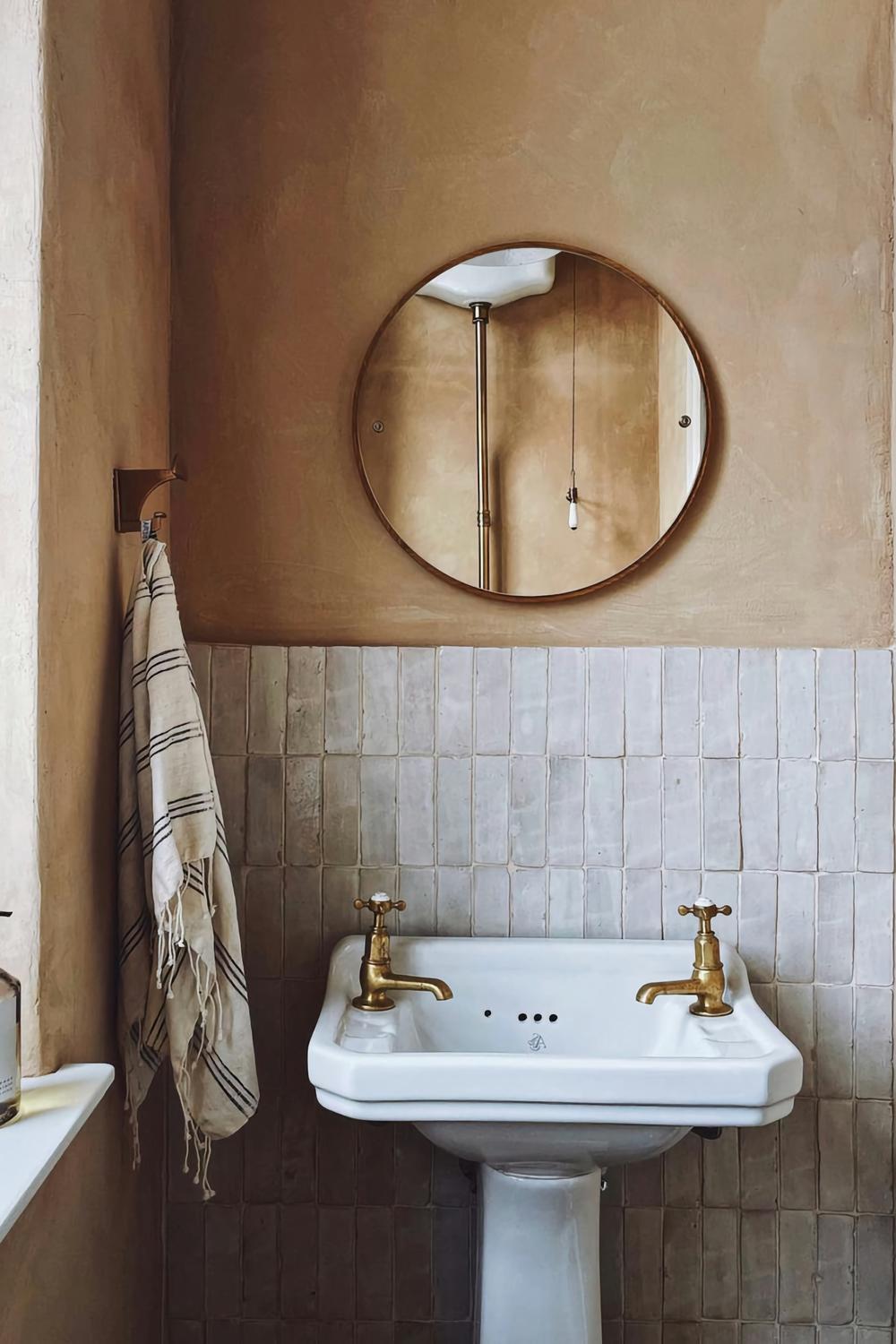 A rustic yet modern bathroom featuring limewash and ceramic finishes.