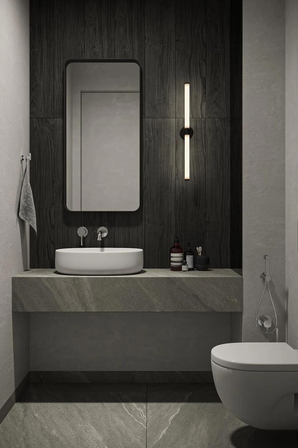 Baño minimalista en tonos neutros, lavabo moderno y estilo sobrio