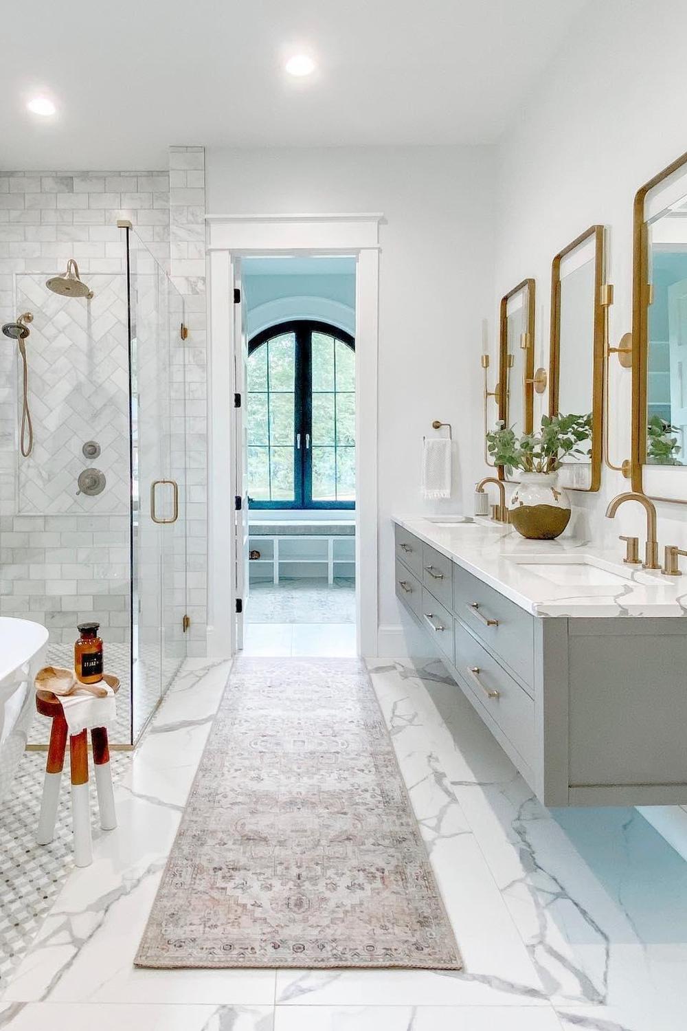 A sophisticated marble bathroom featuring a blend of black and white marble, made from elegant and high-quality materials.