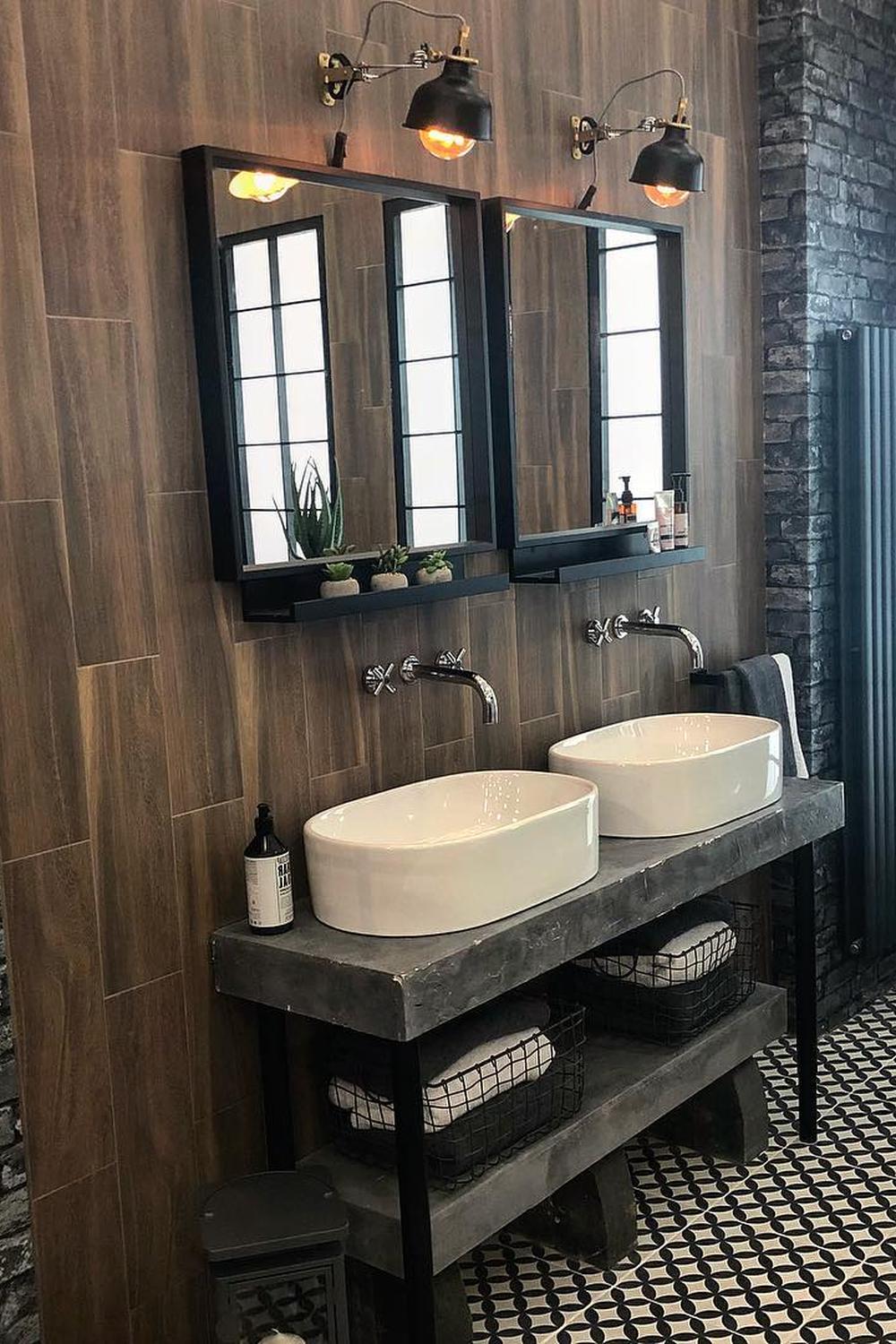 A rustic industrial masculine bathroom featuring dual sinks and unique finishes.