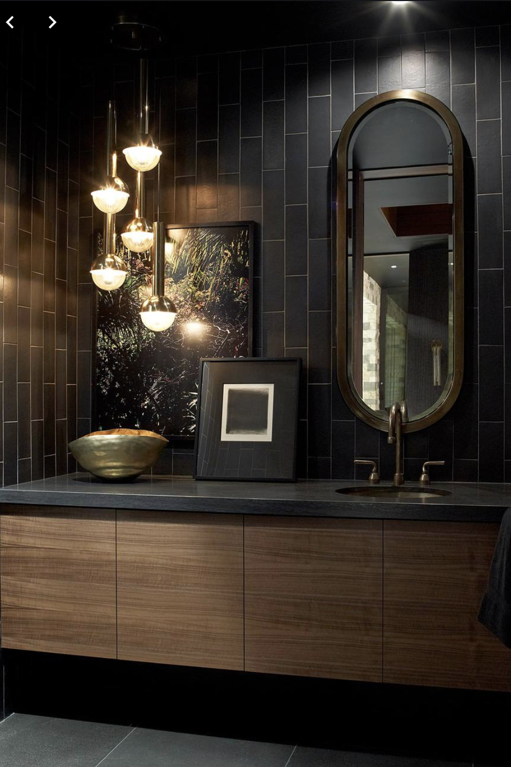 A subtle gray-themed masculine bathroom featuring layered textures and clean lines.