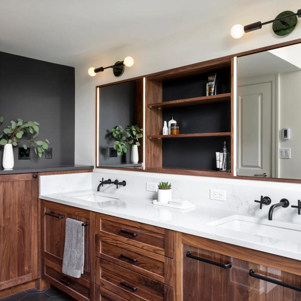A warm masculine bathroom featuring natural wood and light fixtures.