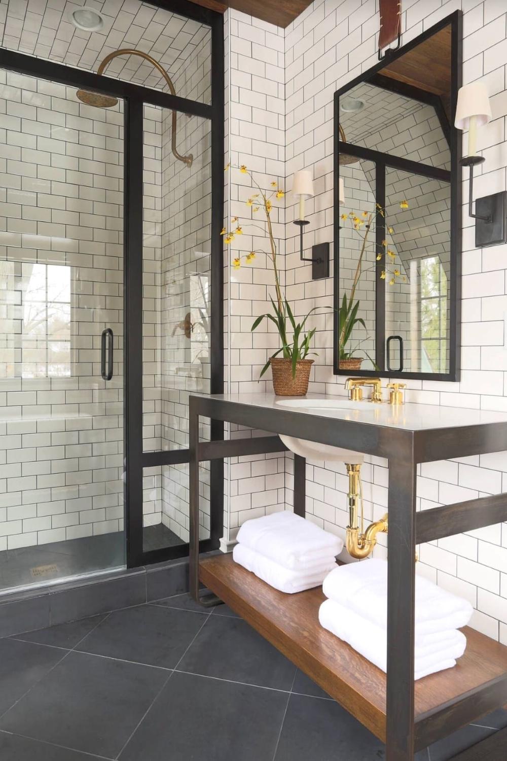 A thoughtfully designed masculine bathroom featuring clean lines and elegant materials.