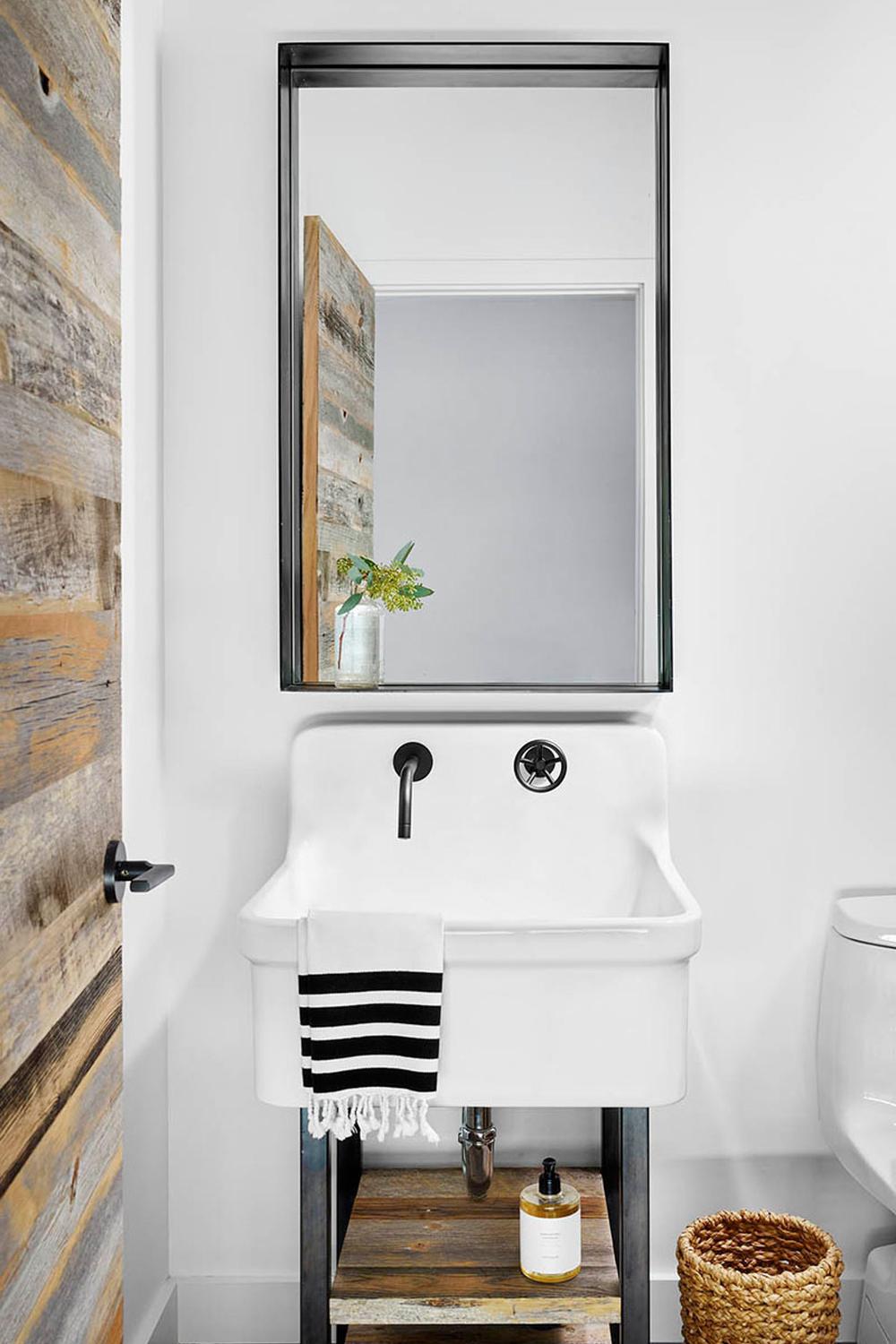 An inviting masculine bathroom featuring a blend of urban and rustic touches.