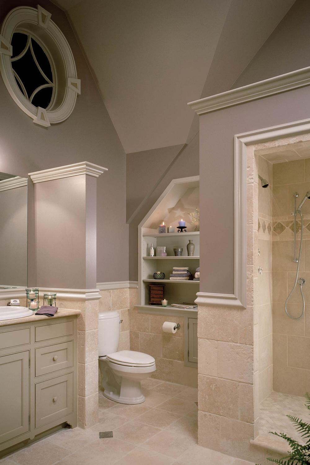 Cozy mauve bathroom featuring a light stone countertop and decorative shelving.