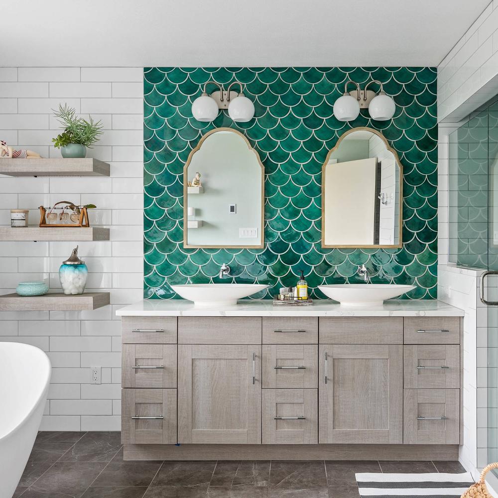 Sophisticated bathroom with iridescent green scalloped tiles and double vanity