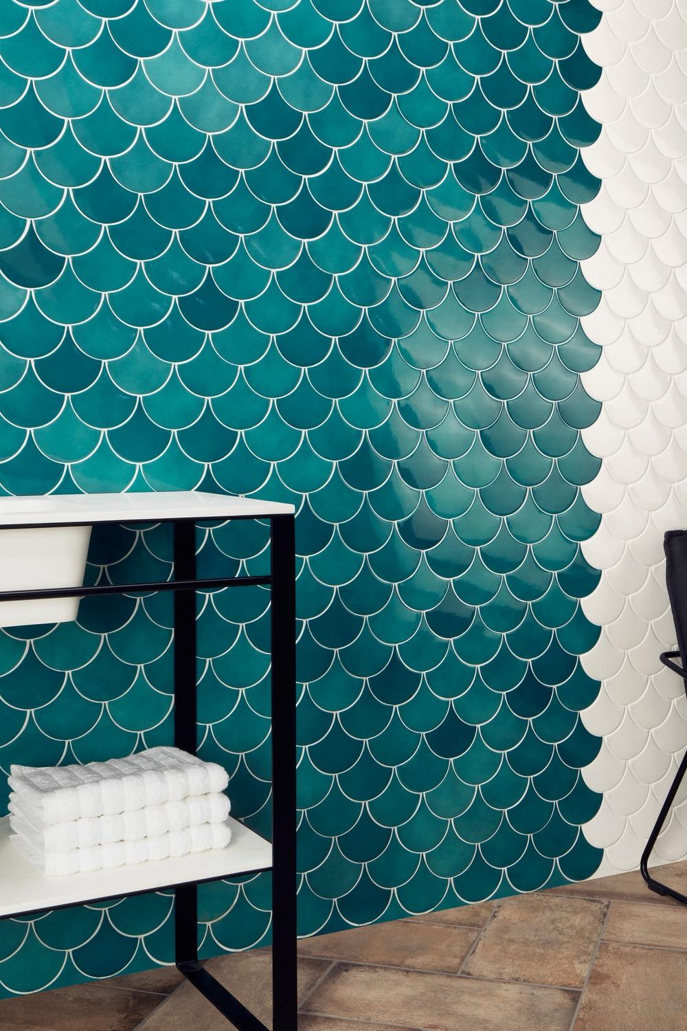 Beautifully designed bathroom wall decorated with contrasting teal mermaid-inspired tile