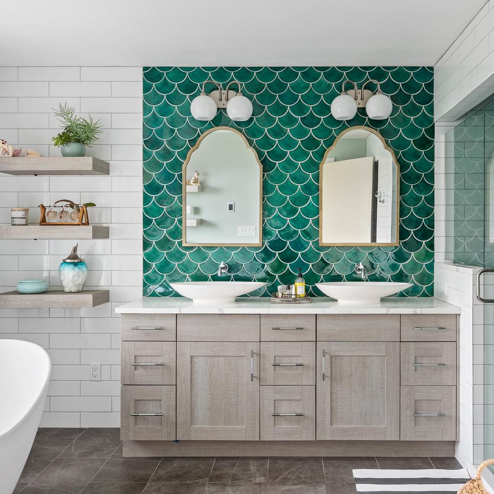 Stylish bathroom featuring teal tile and cozy wooden elements