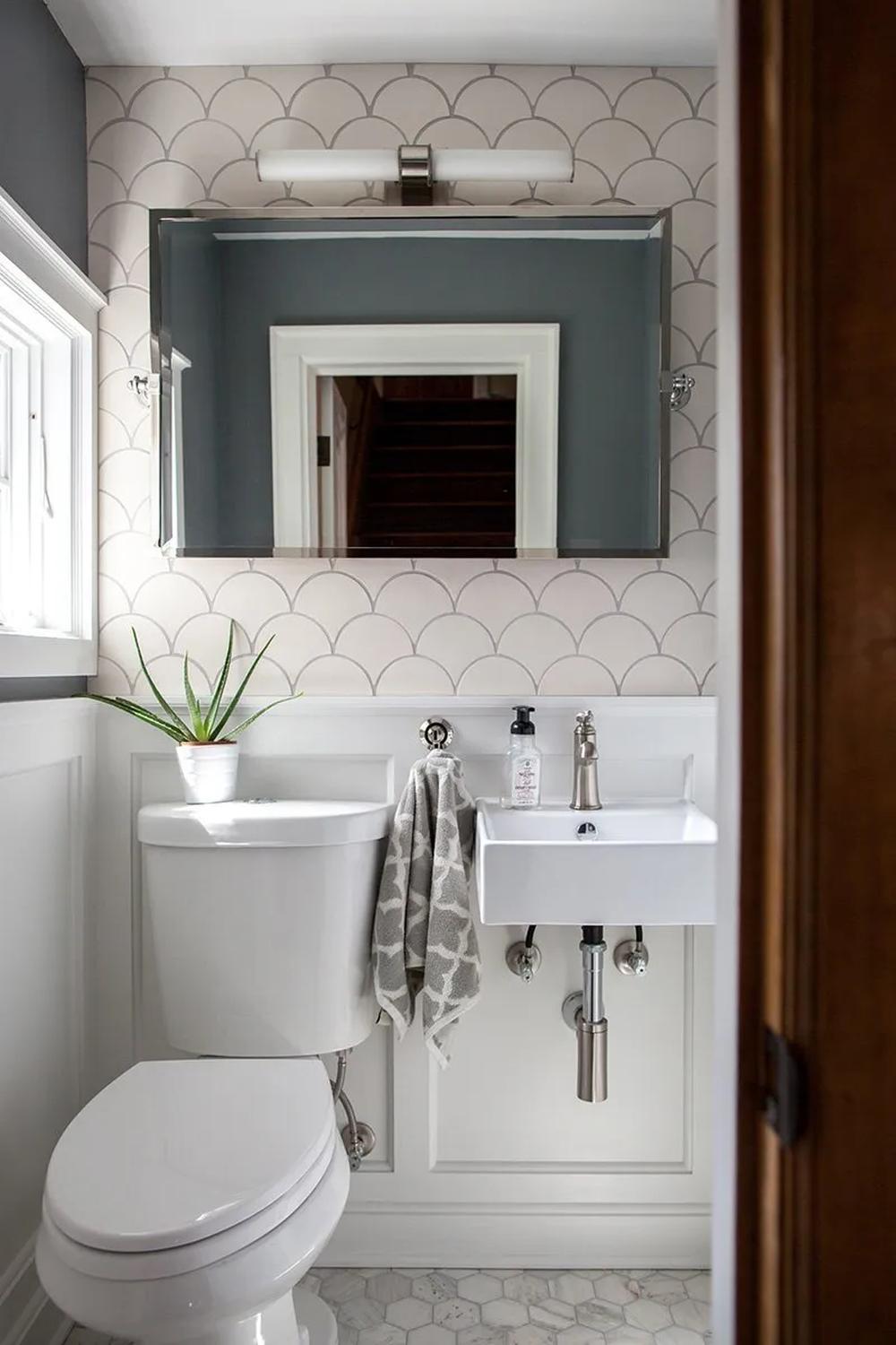 Stylish bathroom featuring mermaid scale patterns and a modern design