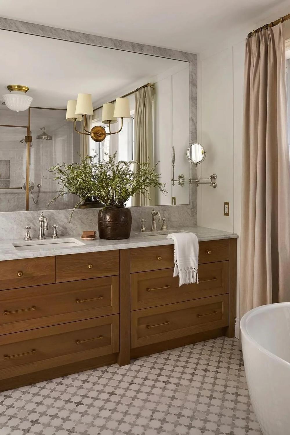 Elegant wooden bathroom vanity with brass hardware and marble countertop