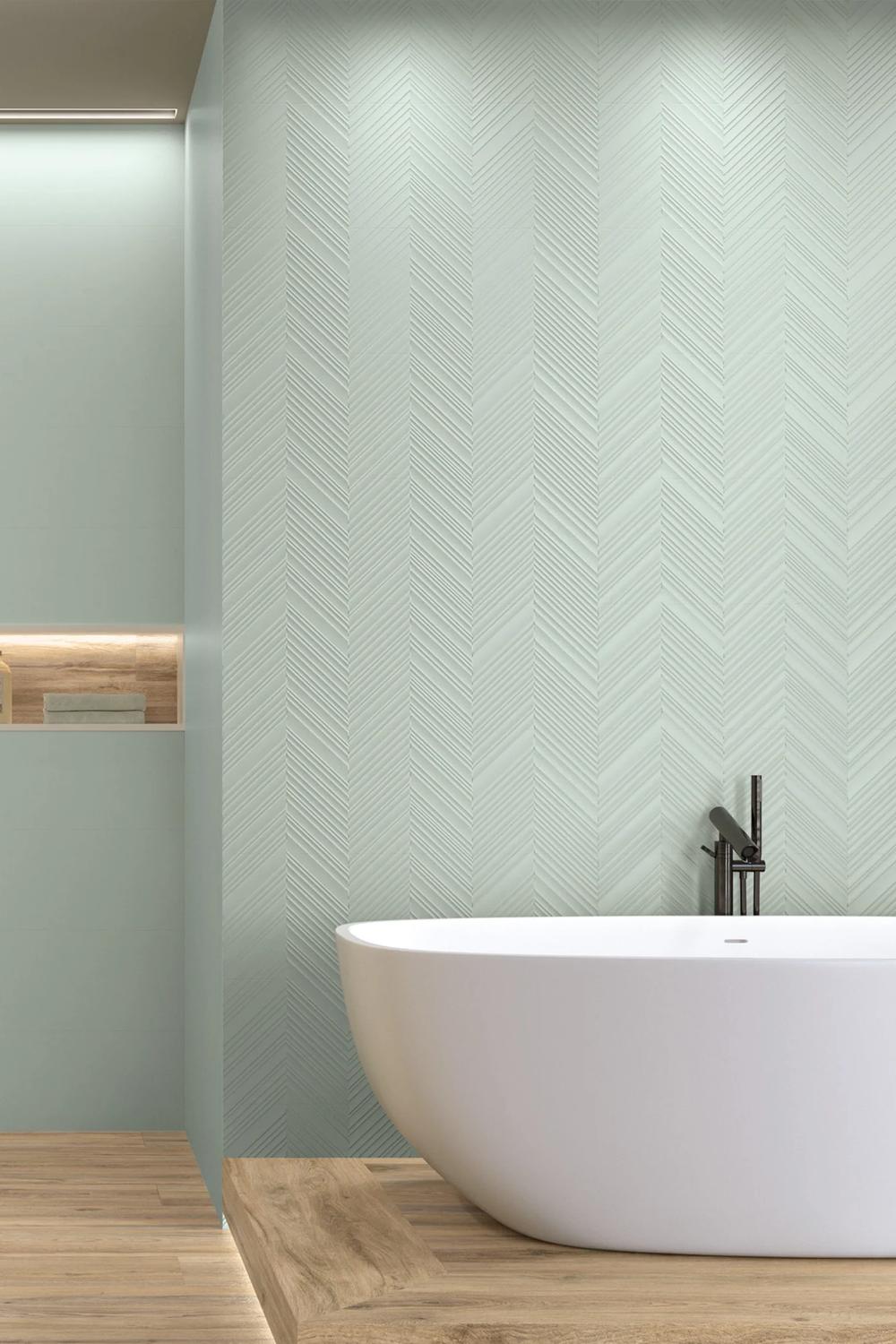 Modern bathroom with a freestanding tub and mint green tiled walls