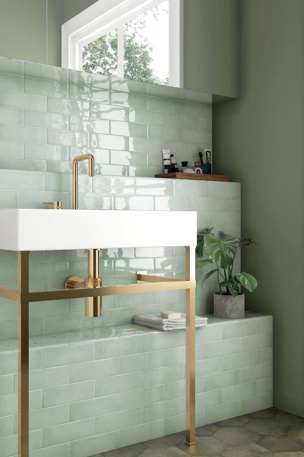 Elegant bathroom with mint green tiles and wooden accents