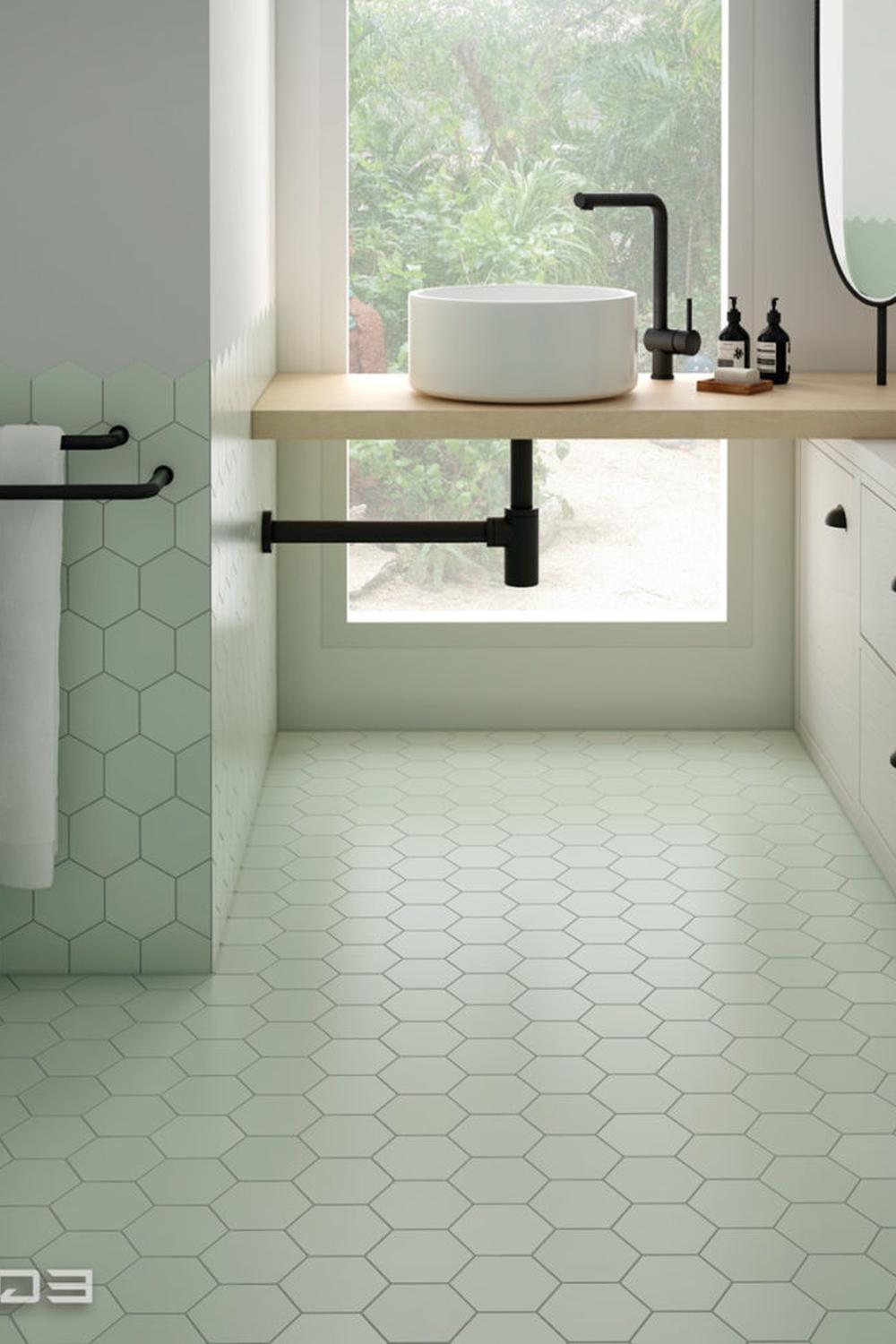 Modern bathroom displaying mint green tiles and tranquil elements