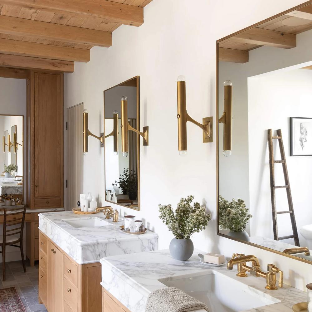 Modern farmhouse bathroom with neutral colors and a focus on minimalist design.