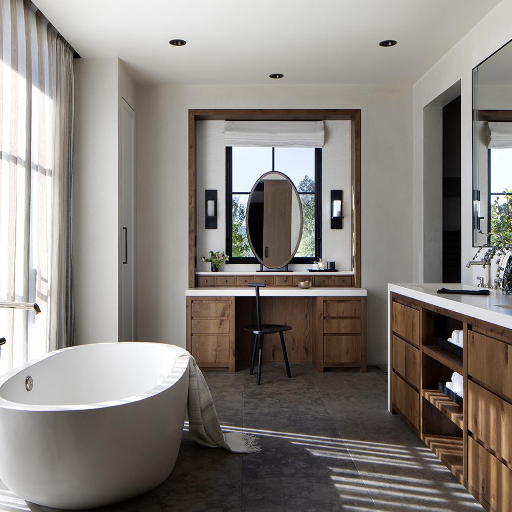 Charming modern farmhouse bathroom featuring a freestanding bathtub and natural design elements.