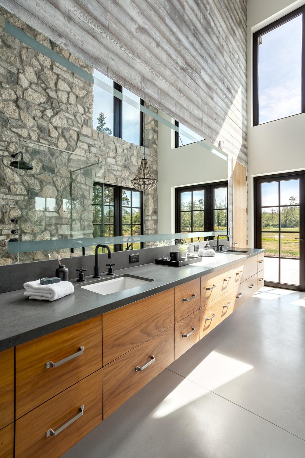 Modern farmhouse bathroom featuring a mix of rustic and contemporary designs.