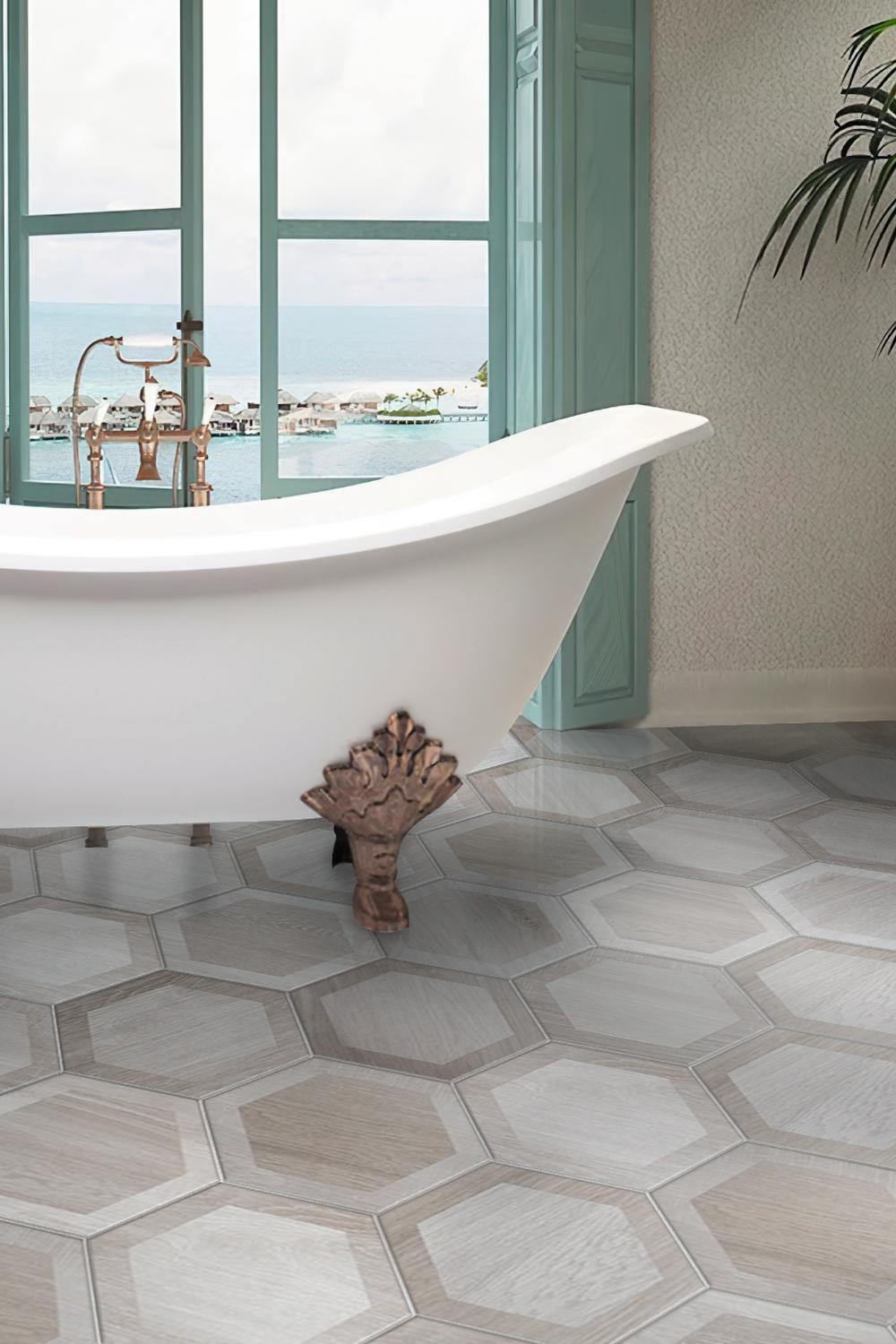 A luxurious modern bohemian bathroom featuring a freestanding white bathtub and patterned tiles.
