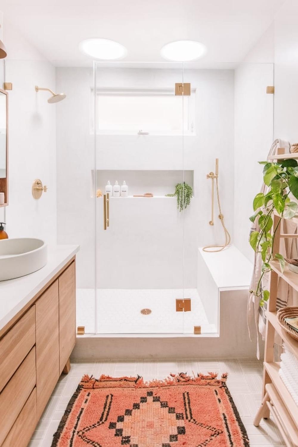 A cozy modern bohemian bathroom featuring a walk-in shower with patterned tiles.