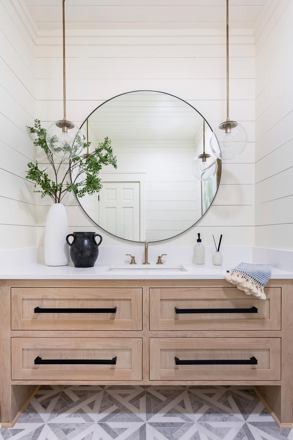A modern cottage bathroom featuring clean lines, shiplap walls, and a cozy ambiance.