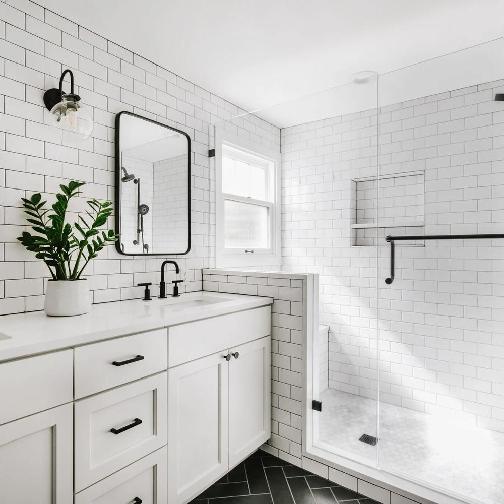 Modern farmhouse bathroom designed with opulent features.