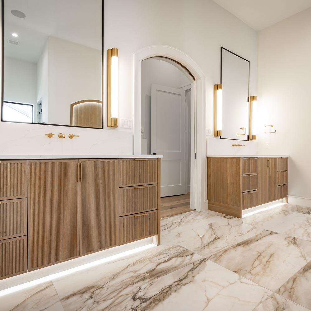 Classic Mediterranean bathroom featuring dual vanities and elegant details.