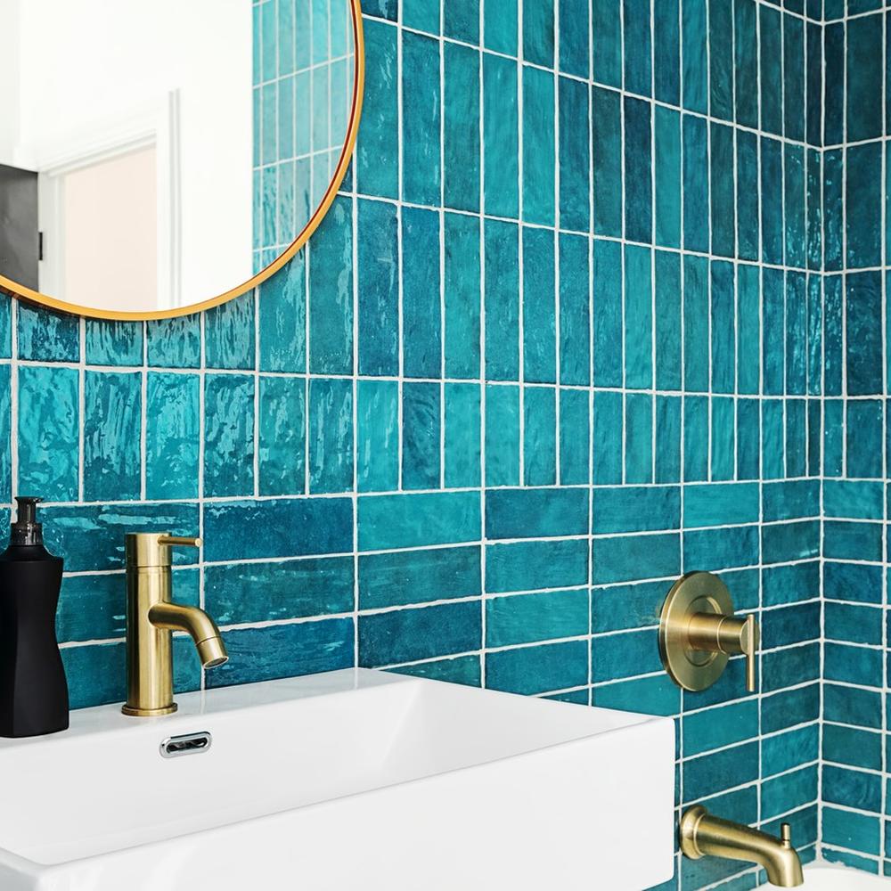 Stylish bathroom designed in soothing aqua tones, balancing modern aesthetics.