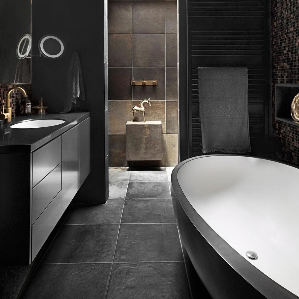 Sleek modern bathroom with dark tones and minimalistic features