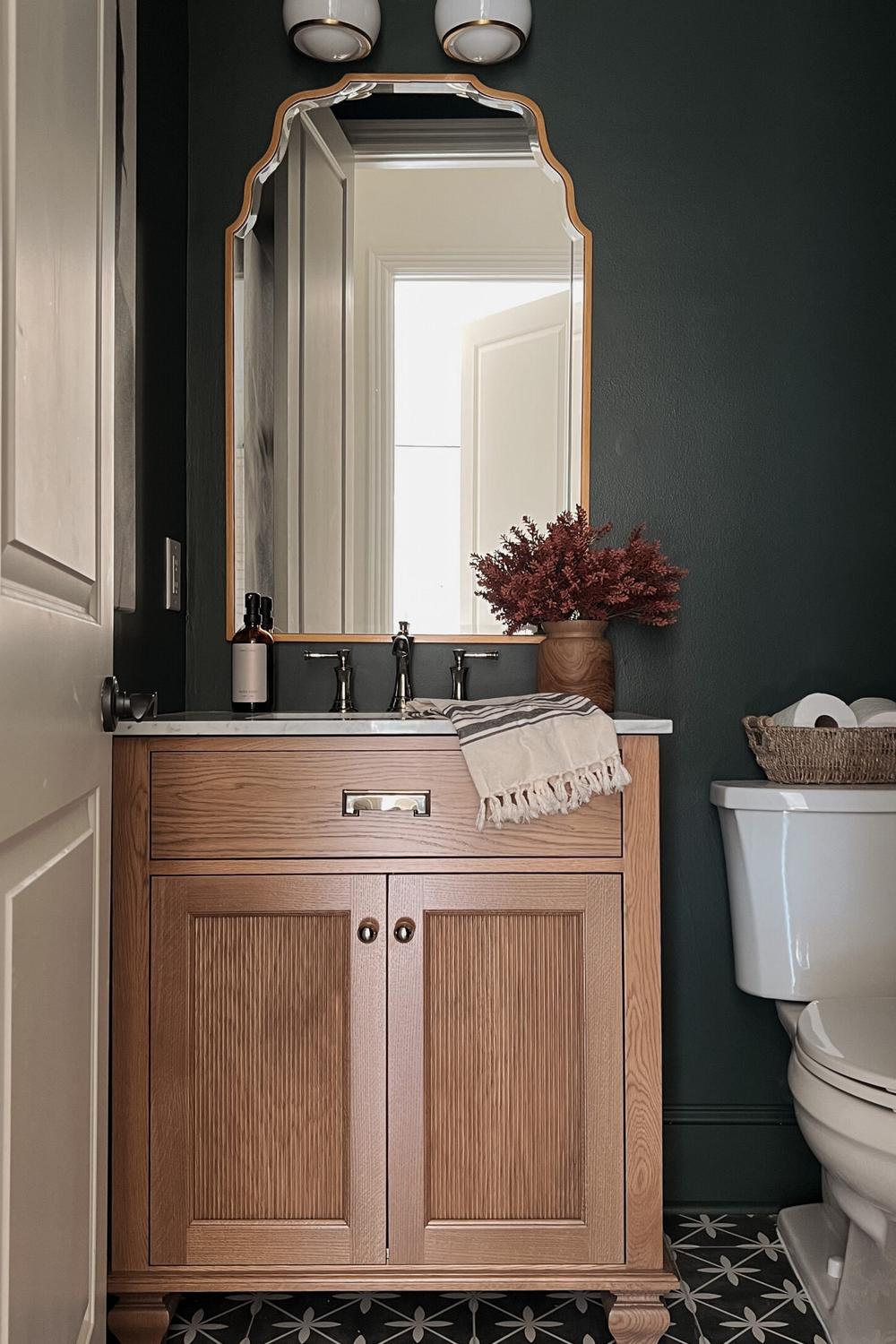Elegant bathroom with personal touches and rich textures