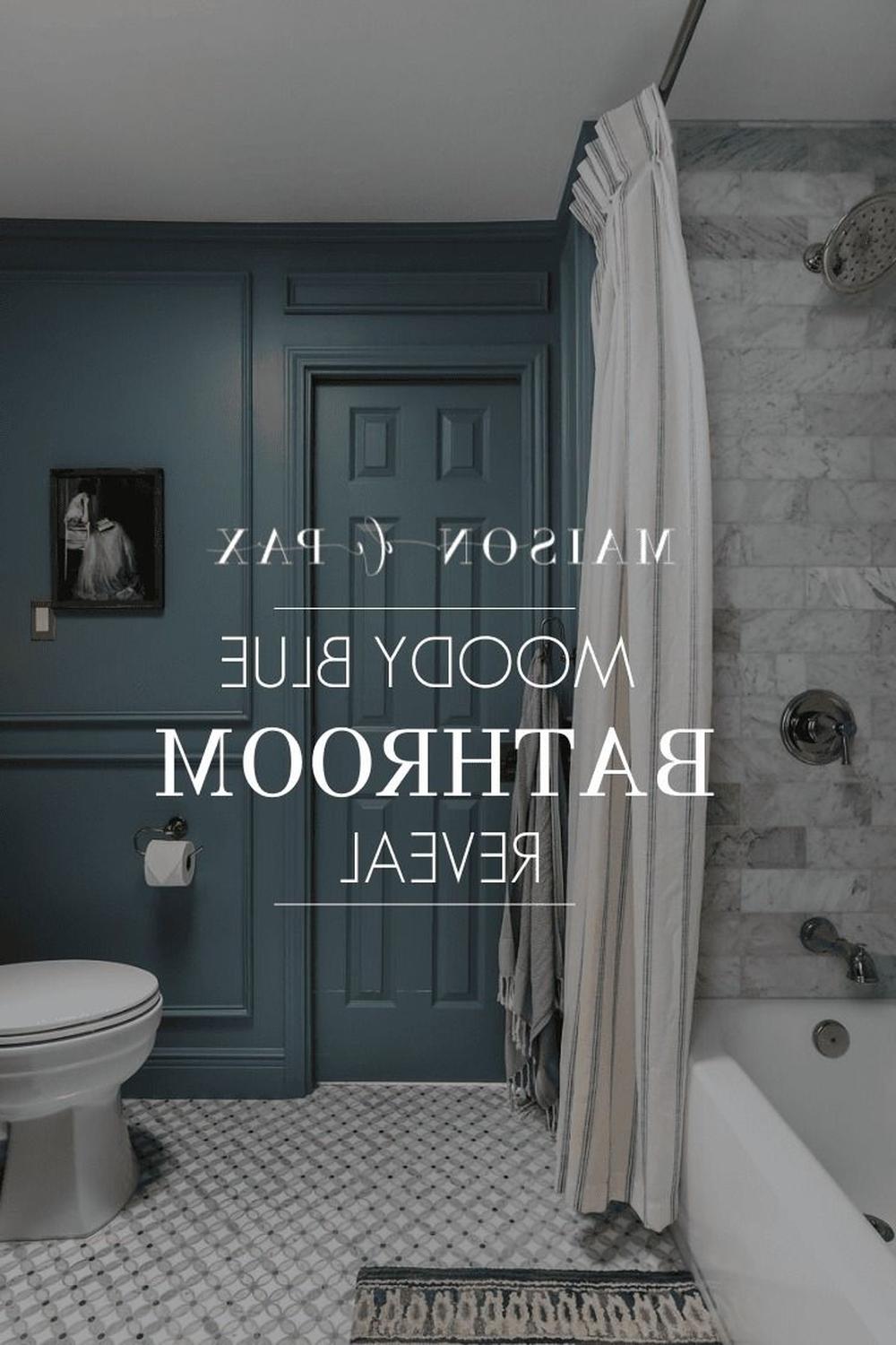 A moody blue bathroom showcasing soft tones and serene fixtures.