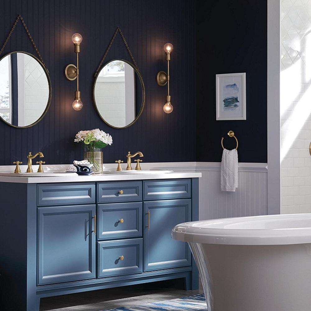 A timeless moody blue bathroom featuring elegant marble accents and stylish fixtures.