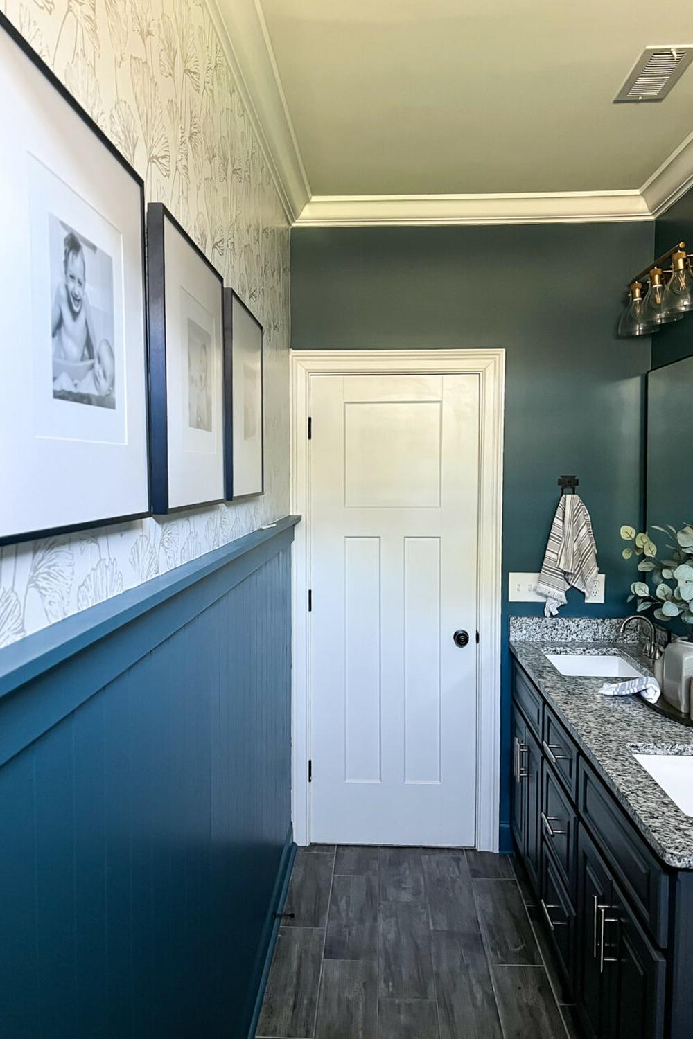 A moody blue bathroom exhibiting simplistic design with natural beauty.