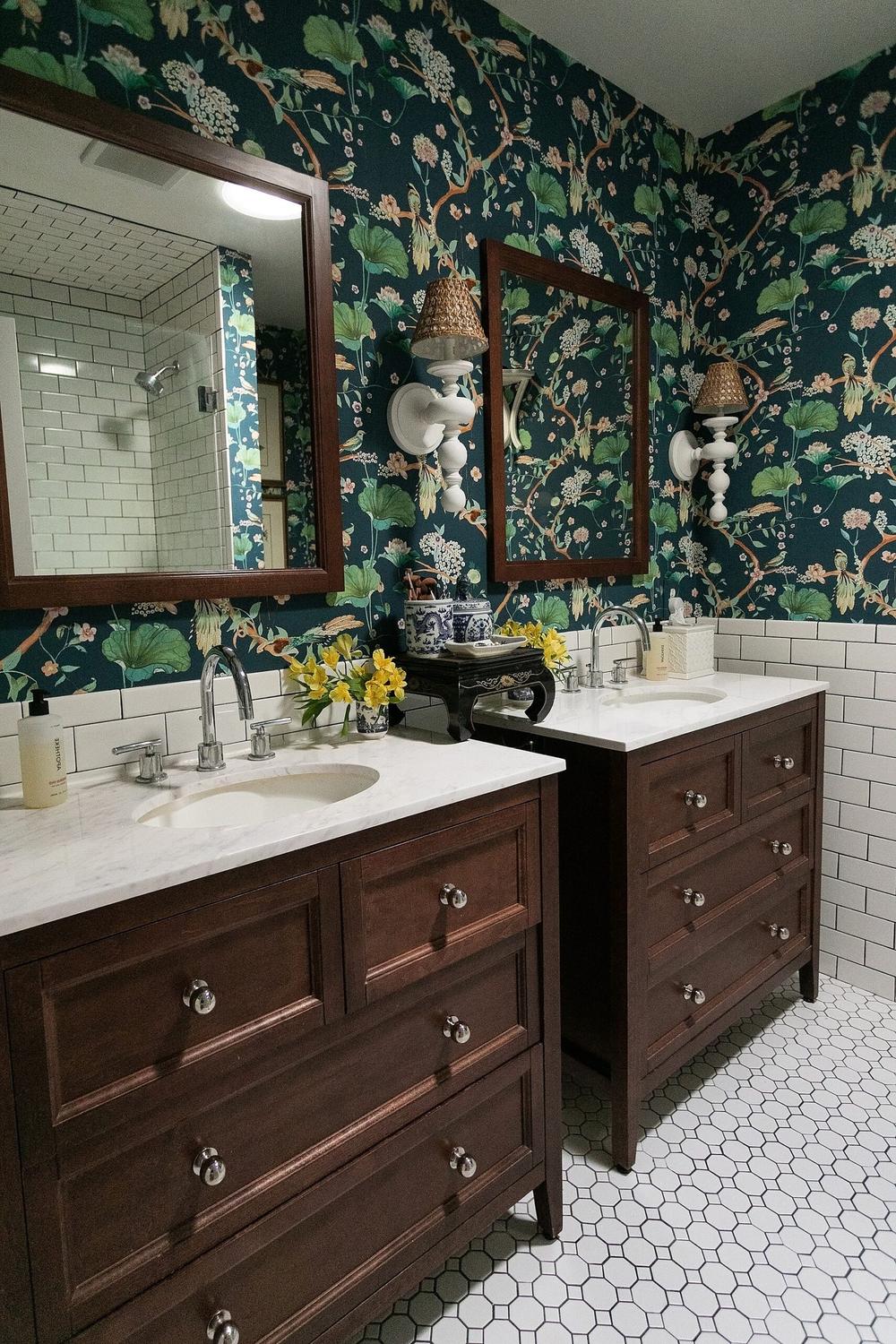 A vibrant moody blue bathroom featuring floral patterns and contrasting tones.