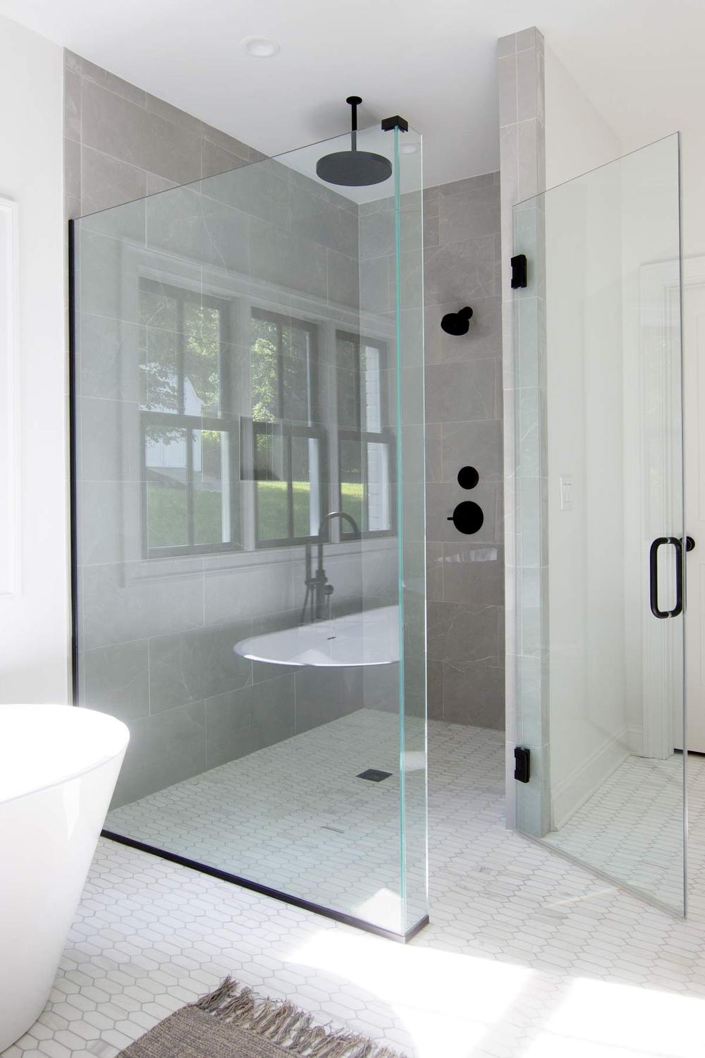 Modern bathroom with a frameless glass shower enclosure.