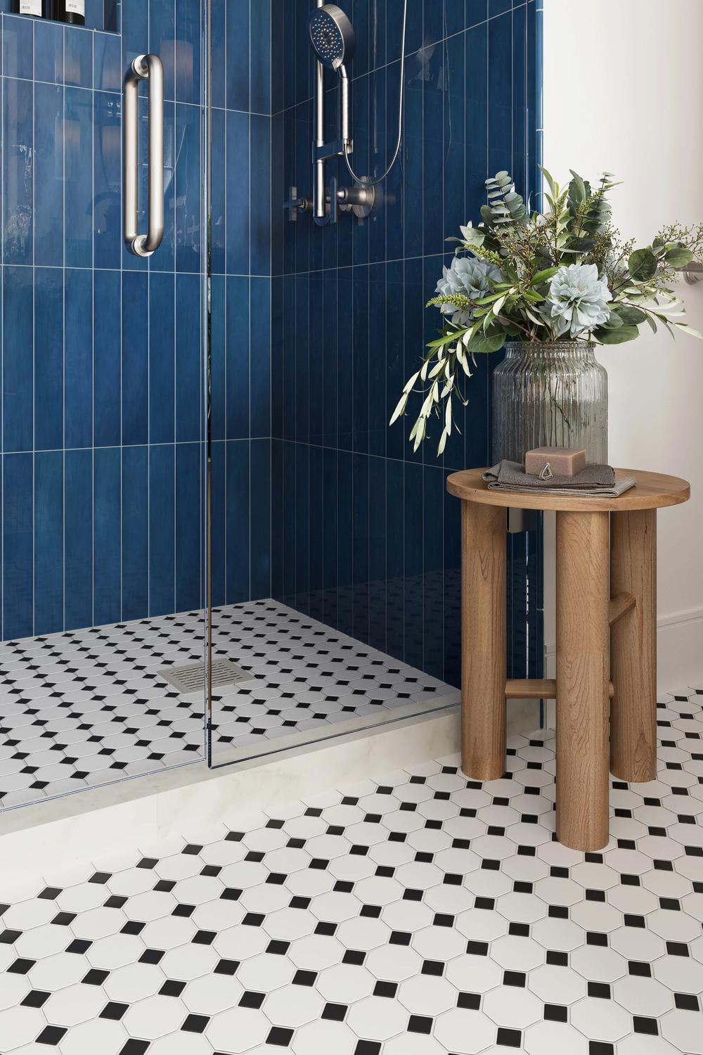 Timeless bathroom design featuring bold blue accents and elegant tiles.