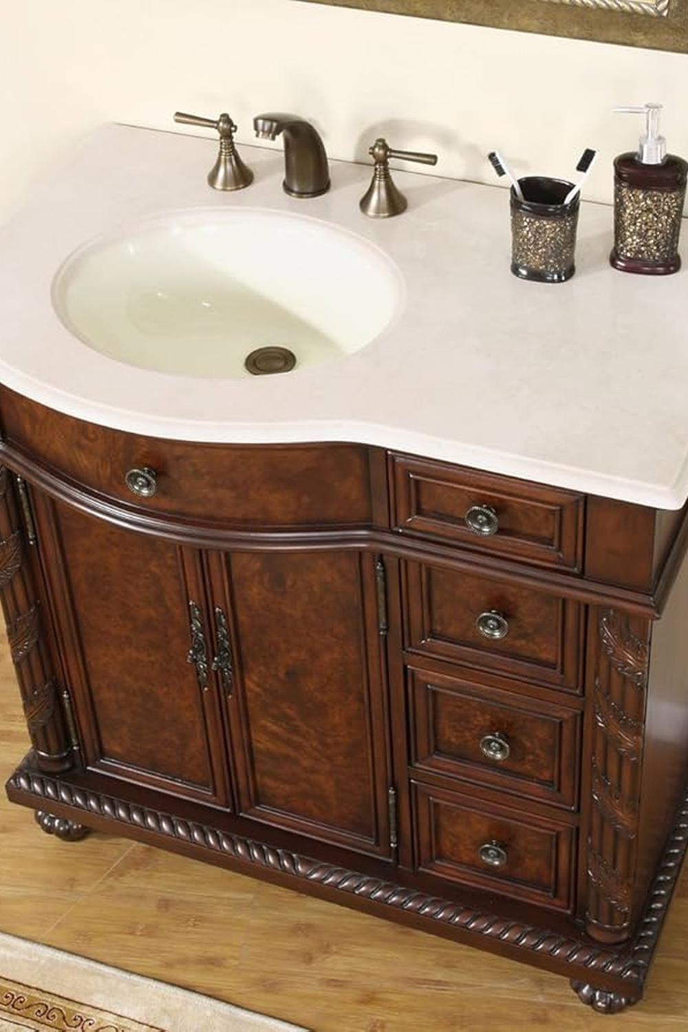 Rinconera de lavabo clásica con lavabo integrado, detalles en madera tallada