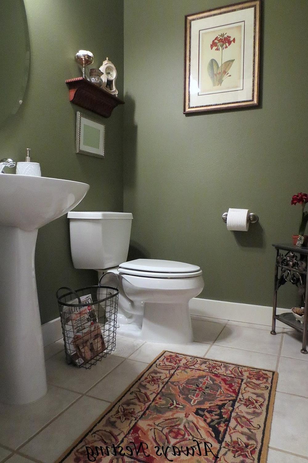 A cozy nook within a bathroom featuring olive green hues.